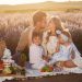 A joyful family picnic in a lavender field, capturing togetherness and love at sunset.